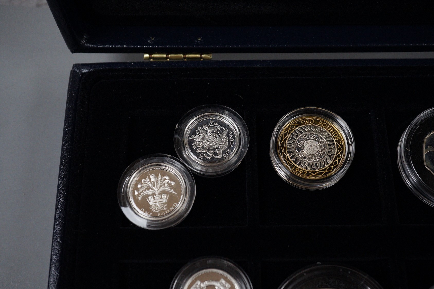 A group of Royal Mint UK commemorative silver proof coins, including 1996 Northern Ireland £1, 1983 royal arms £1, 1995 Welsh £1, 2005 Dictionary 250th anniversary coin, four minute mile 50p, 1997 £2, 50th anniversary D